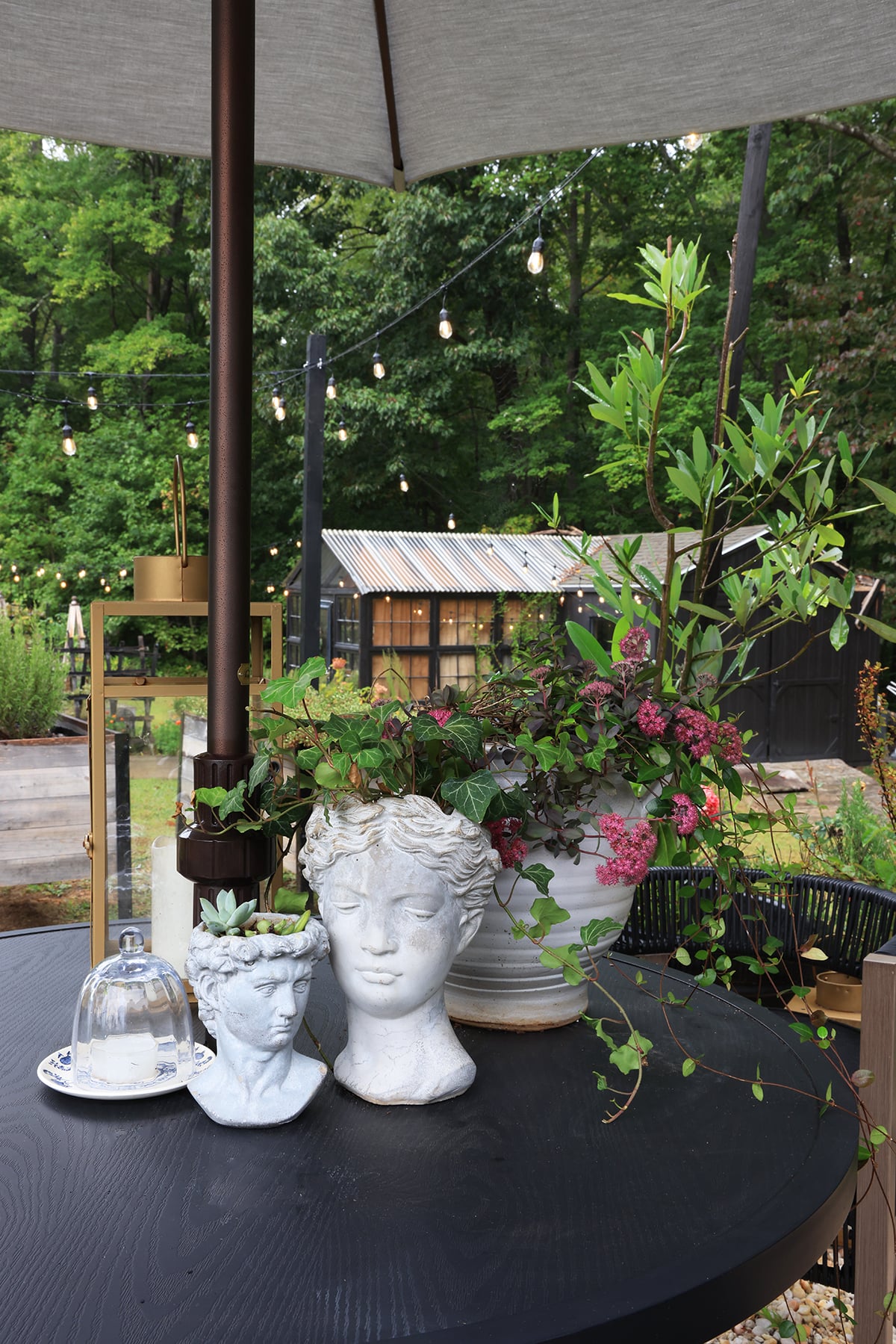 Patio dining table with statue planter bust