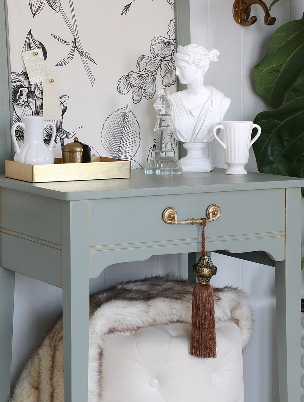 Decorative tassel hanging from a drawer pull