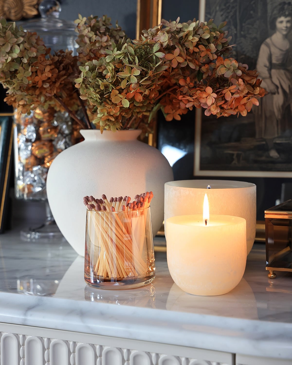 Vignette with red foliage and candles