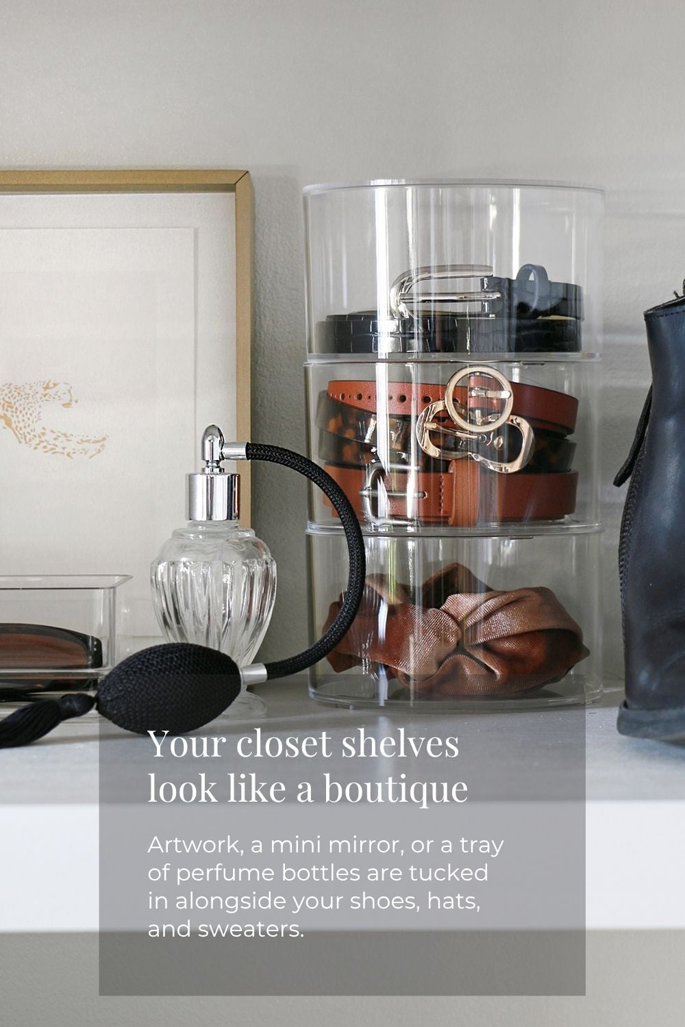 Clear belt holder and perfume bottle on a closet shelf
